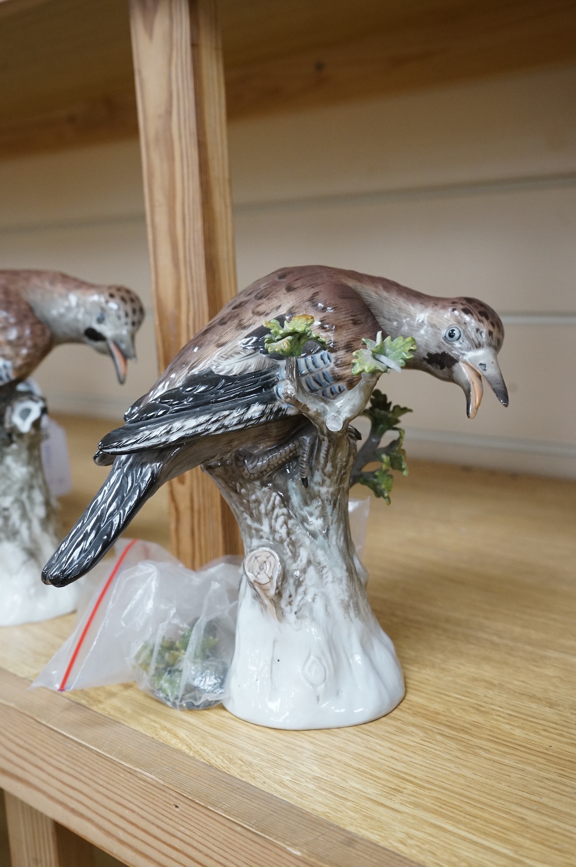 A pair of Meissen style porcelain models of Jays, 18cm